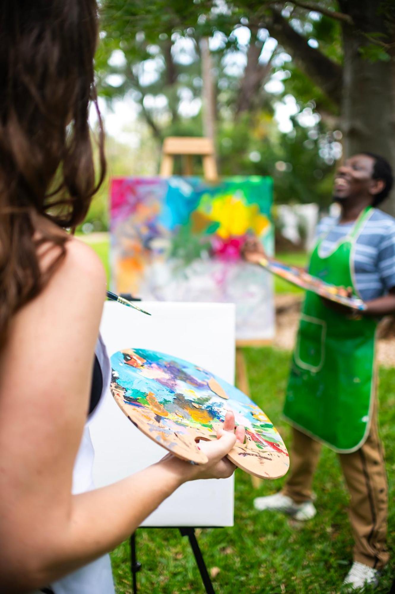Diamonds Leisure Beach & Golf Resort Diani Beach Esterno foto A painter working on a canvas